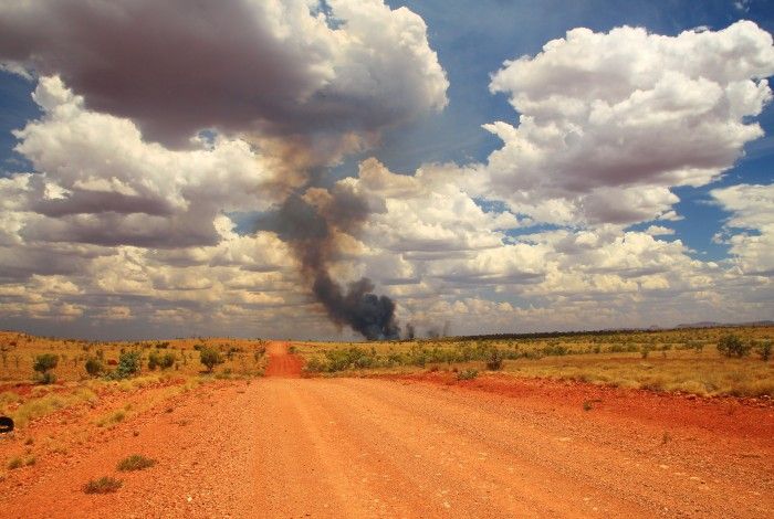 Smoke from a bush fire in the distance of an outback horizon