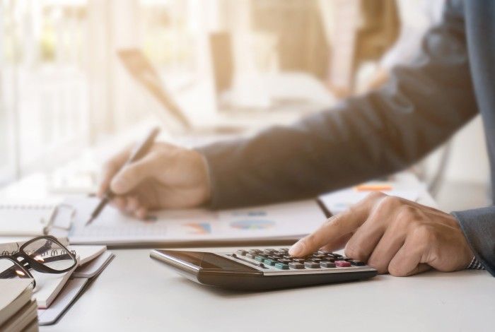 person sitting at desk with laptop