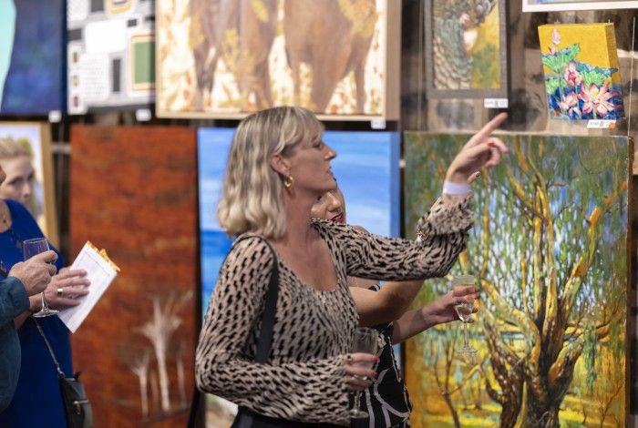 A person admiring art at the Cossack Art Awards