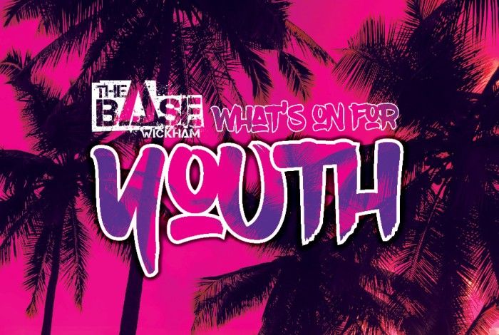 Bright pink and purple tropical-themed graphic featuring palm trees with the text “The Base Wickham, What’s On for Youth” in bold graffiti-style lettering.