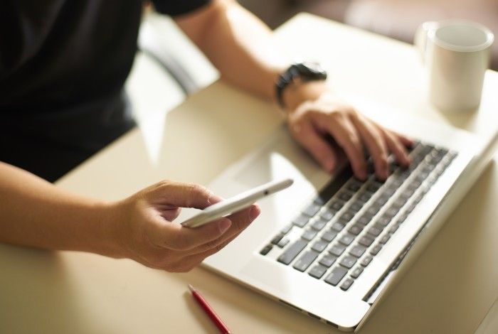 graphicstock-young-sman-hand-using-smart-phonemobile