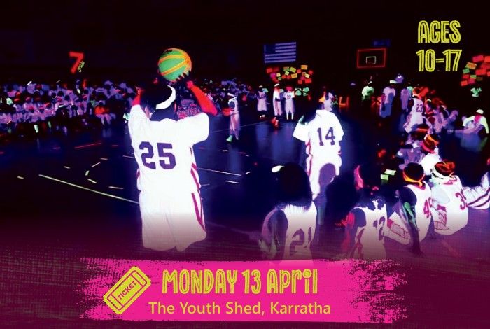 Young people wearing basketball jerseys play a glow-in-the-dark basketball game in a gym lit with neon colours and blacklights. A pink banner reads “Monday 13 April – The Youth Shed, Karratha,” and text on the right says “Ages 10–17.”