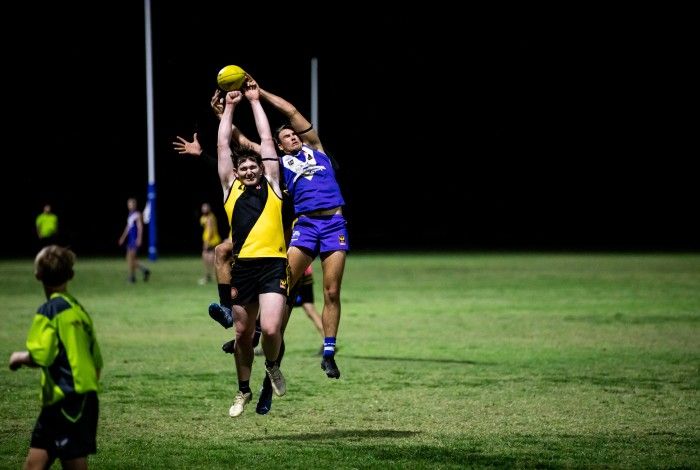 Two football players in a marking contest