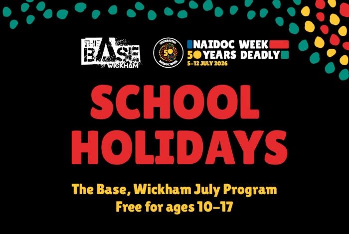 A promotional banner for The Base Wickham July School Holiday Program during NAIDOC Week 2026. The design features a black background with decorative teal, red and yellow dot patterns across the top. The Base Wickham logo and the NAIDOC Week 2026 logo appear at the top. Large red text reads “SCHOOL HOLIDAYS”, with yellow text underneath stating “The Base, Wickham July Program” and “Free for ages 10–17”.
