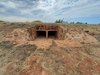 Picture of old culvert underneath road in daytime